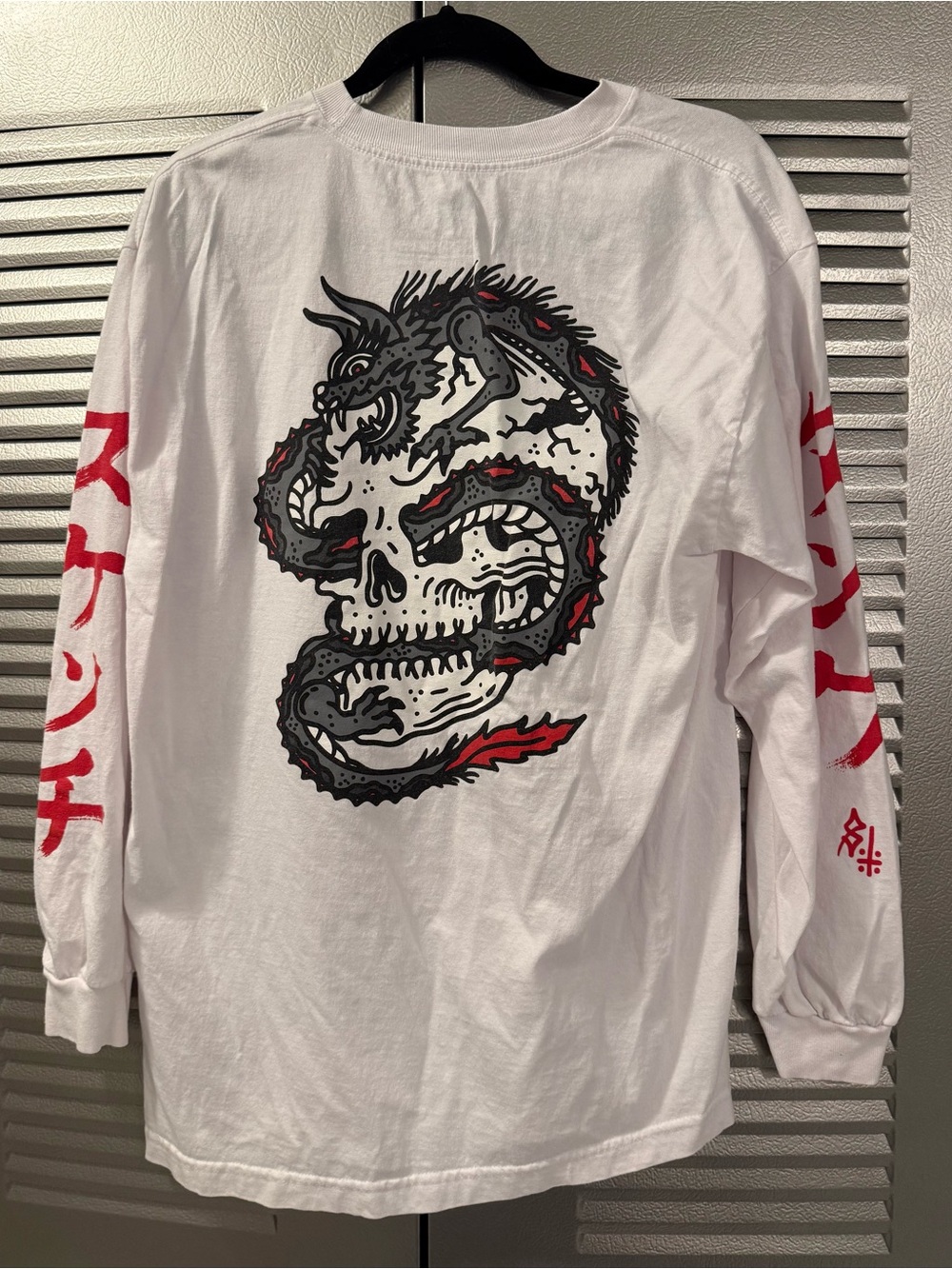 White Long-Sleeve Graphic Shirt with Dragon Skull Artwork